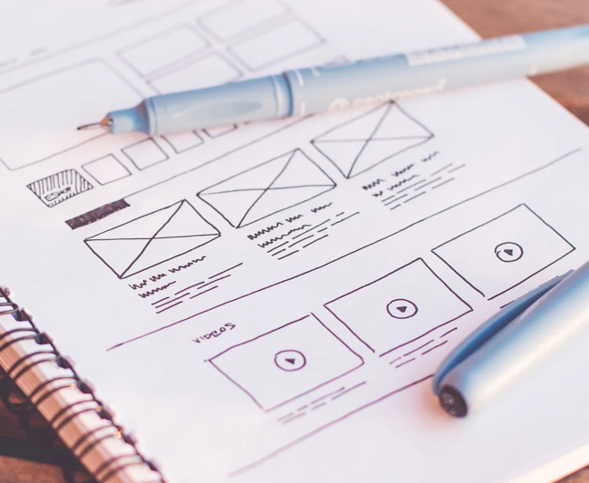 Design picture of notepad and wireframe sketches